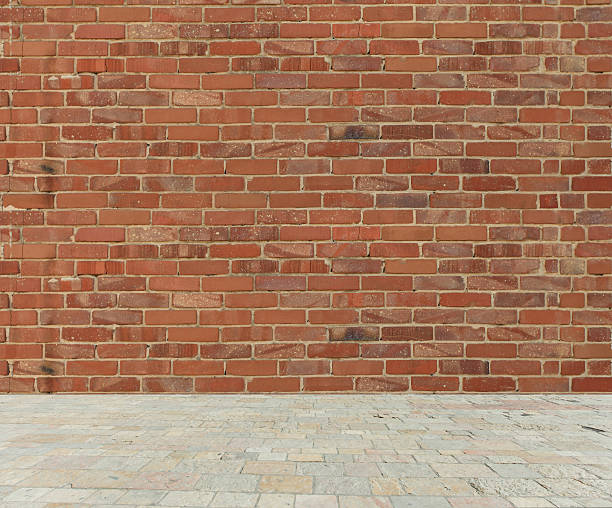 istock Old red brick wall with stone marble floor 471047198