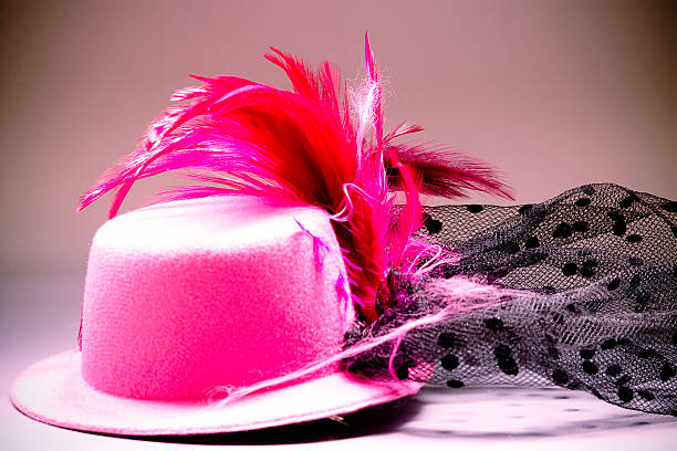 istock Pink velvet hat and tassel on the table 471047680