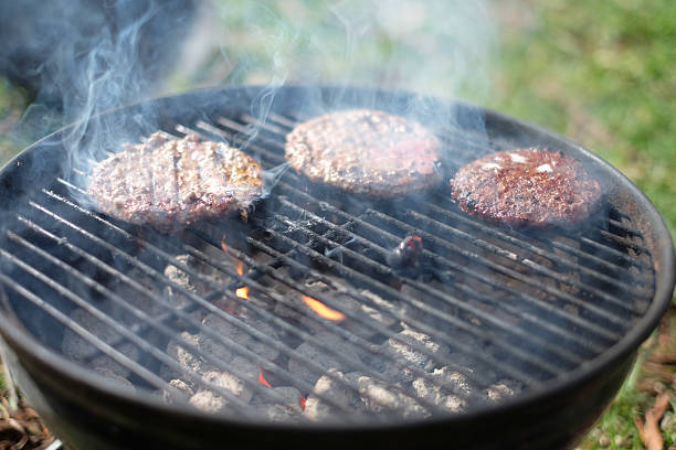 istock Hamburger Patties on the grill 471048534