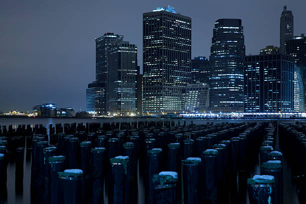 Lower Manhattan skyline night view from Brooklyn Bridge Park in New York City.