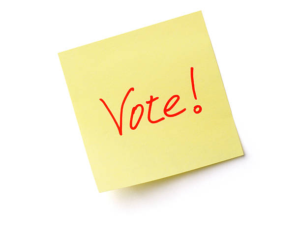istock Vote Text on Adhesive Note, an Election Paper Sticky Reminder 471051731