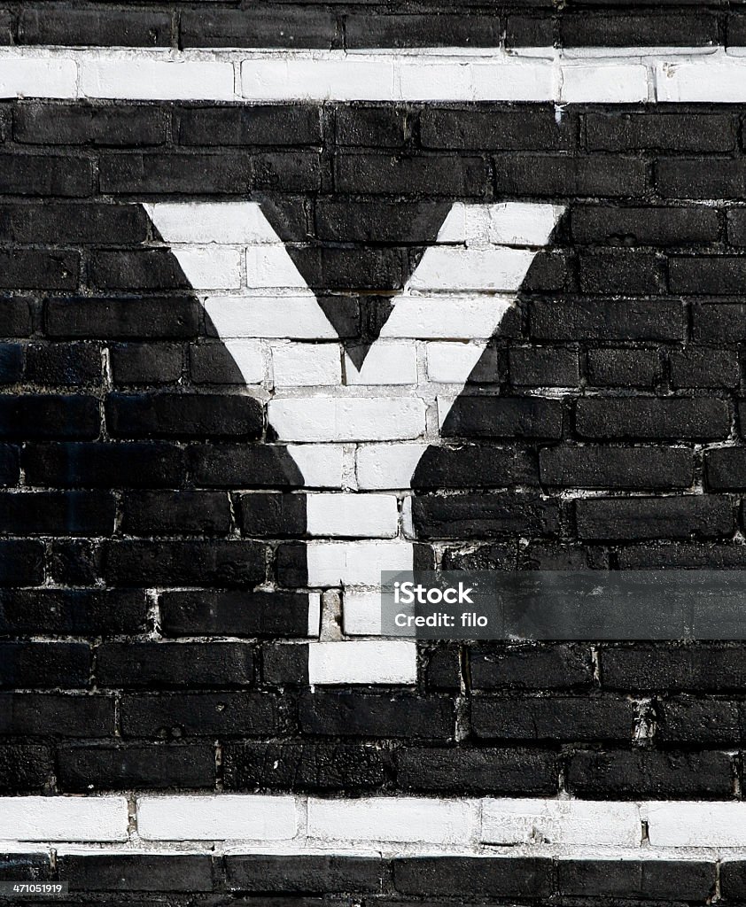 Letter "Y" A white letter "Y" on a black background. Detail from a sign. Alphabet Stock Photo