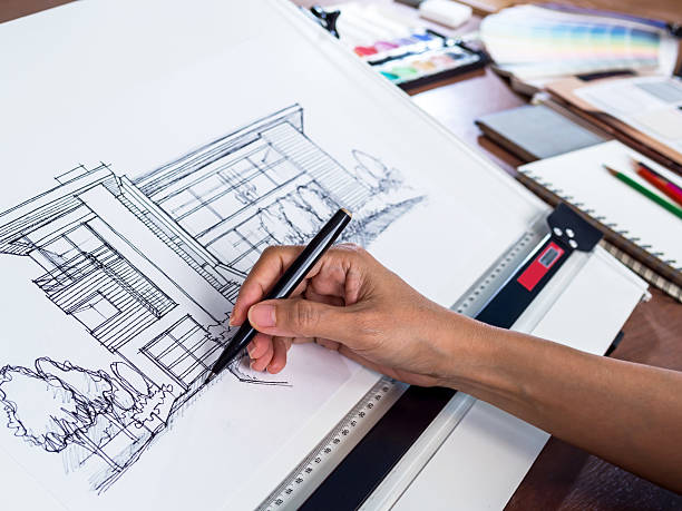 istock Architecture working hard to draw a sketch of a modern house 471052960