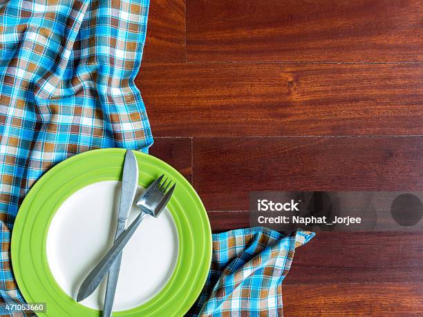 Blank Plate With Fork And Knife On Wooden Table Background Stock Photo - Download Image Now