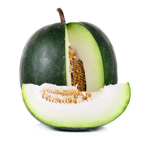 Photo of Green melon with slice cut out on white background