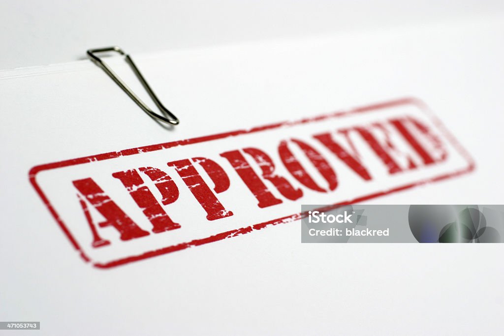 Approved Closeup of "APPROVED" stamp on file. Agreement Stock Photo