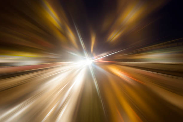 istock car lights on highway by night,abstract light trace background 471055630
