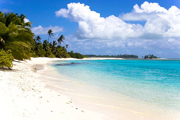 Dream Beach beautiful white sandy beach, turquoise water, light summer clouds cocos stock pictures, royalty-free photos & images