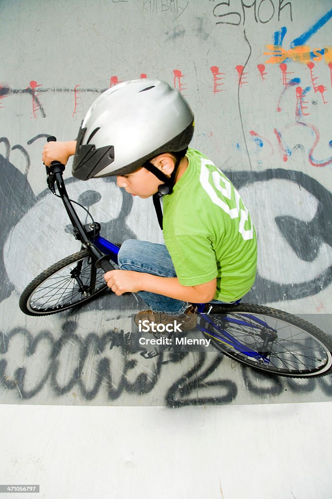 BMX Halfpipe Action young boy, 6 years, speeding with his bmx bike in half-pipe, action portrait. 6-7 Years Stock Photo