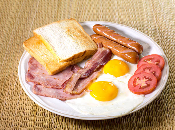 istock Delicious, american breakfast,  bacon, fried egg  and ham 471058094
