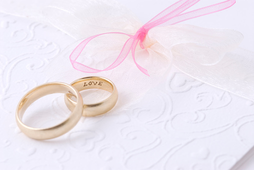 Wedding rings on invitation letter. The word \
