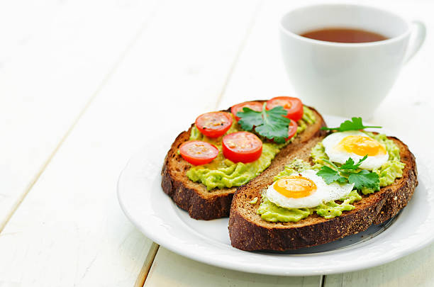 istock rye sandwiches and mashed avocado, eggs, tomatoes and cucumbers 471058438
