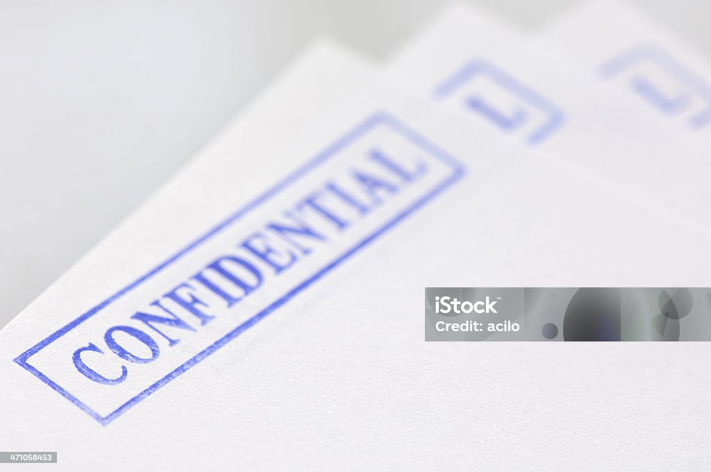 Confidential documents 3 pieces of paper with a "confidential" stamp Privacy Stock Photo
