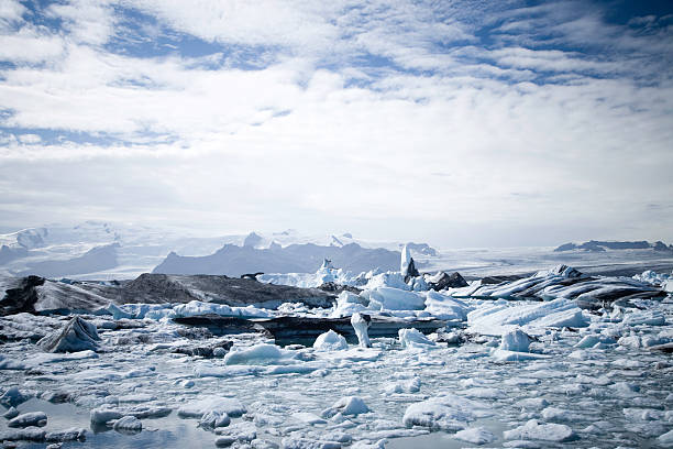 Icebergs drifting in the summer sun from the vatnajokull glacier (largest glacier of europe) directly into the north atlantic ocean, Iceland.