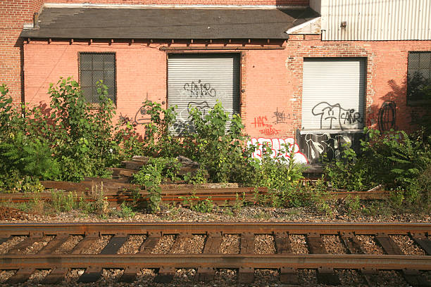 istock Derelict Building Near Railroad Track 471060195