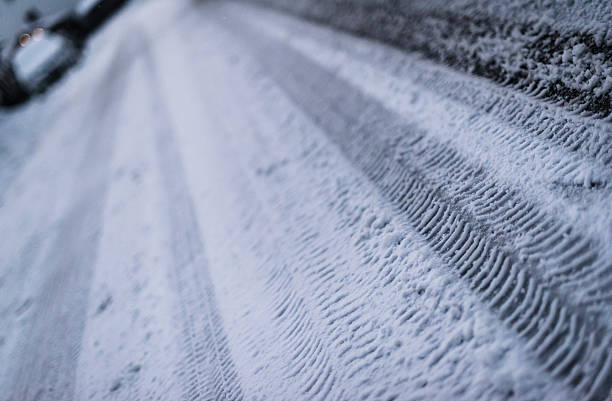 istock Tire tracks on an iced winter street 471060348