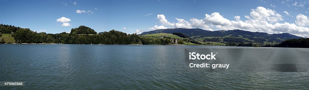 Landscape of the Lake Gruyere Landscape of the Lake of Gruyere with the famous island "Ogoz" and in the rear the meadows and pre-Alps Europe Stock Photo