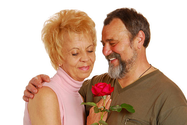 istock Senior couple with red rose 471060707
