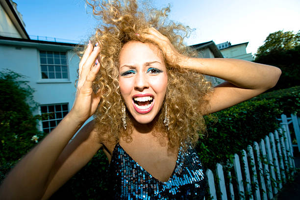 femme crier série - blond hair women curly hair make up photos et images de collection