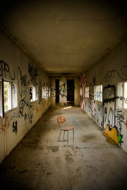 istock abandoned chair in industrial corridor 471062197