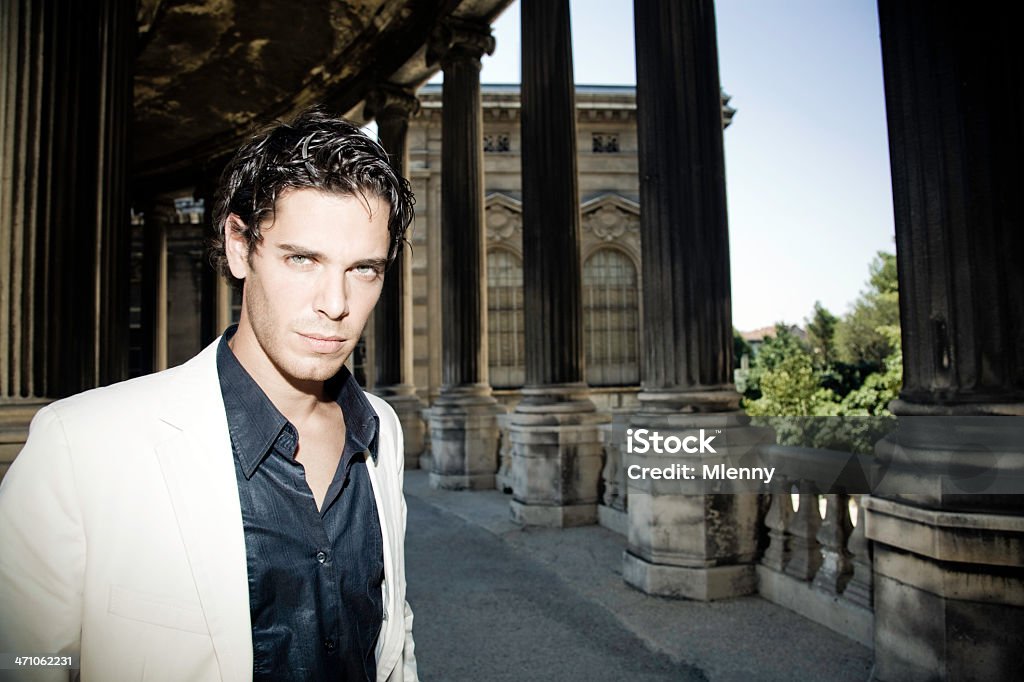 Young Man young fashionable man in white suit in the archway at palais longchamp, marseille. 30-34 Years Stock Photo