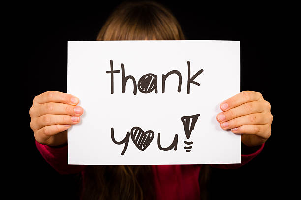 istock Child holding Thank You sign 471063142