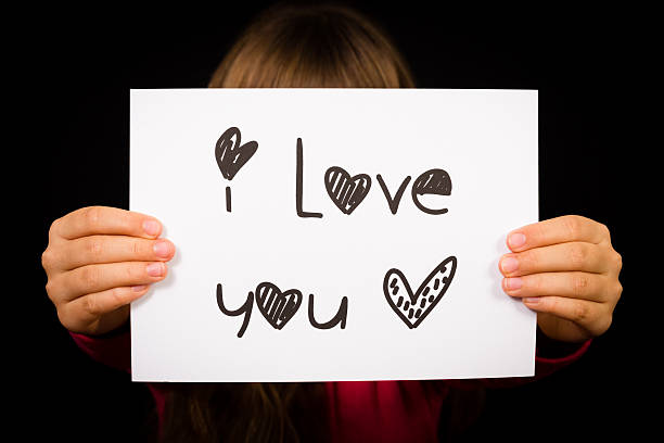 istock Child holding I Love You sign 471063178