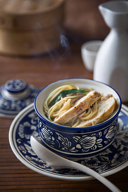 Bowl of Asian chicken noodle soup stock photo