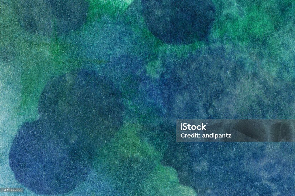 Background of blues and greens with subtle spots Hand painted abstract watercolor and ink background with vibrant colors, primarily shades of green and blue. There are mottled colors in this painting. It has cheerful, bright earth tone colors. 2015 Stock Photo