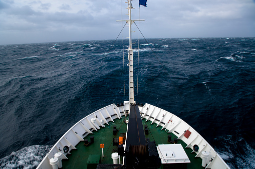 Huge waves in the Drake Passage, on the Icebreaker through the wild ocean on the way to Antarctica, South Atlantic Ocean Passage.