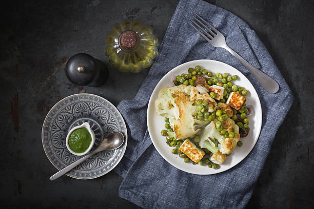 Roasted cauliflower with peas and green chuney stock photo