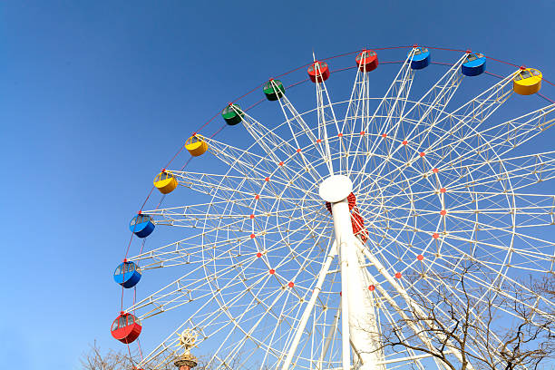 istock Giant ferris wheel against blue sky 471068106