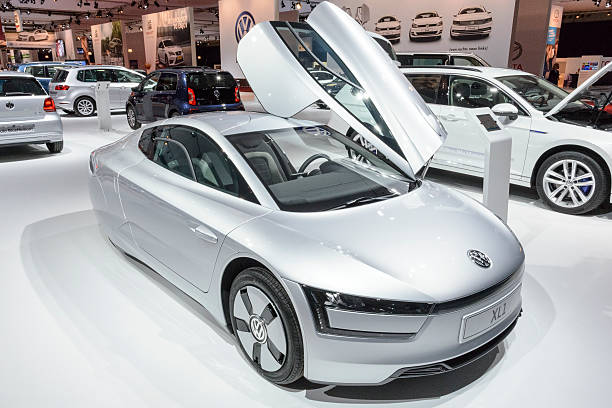 Lisbon, Portugal October 12, 2024, White volkswagen beetle with a sunroof is parked on the side of an asphalt road