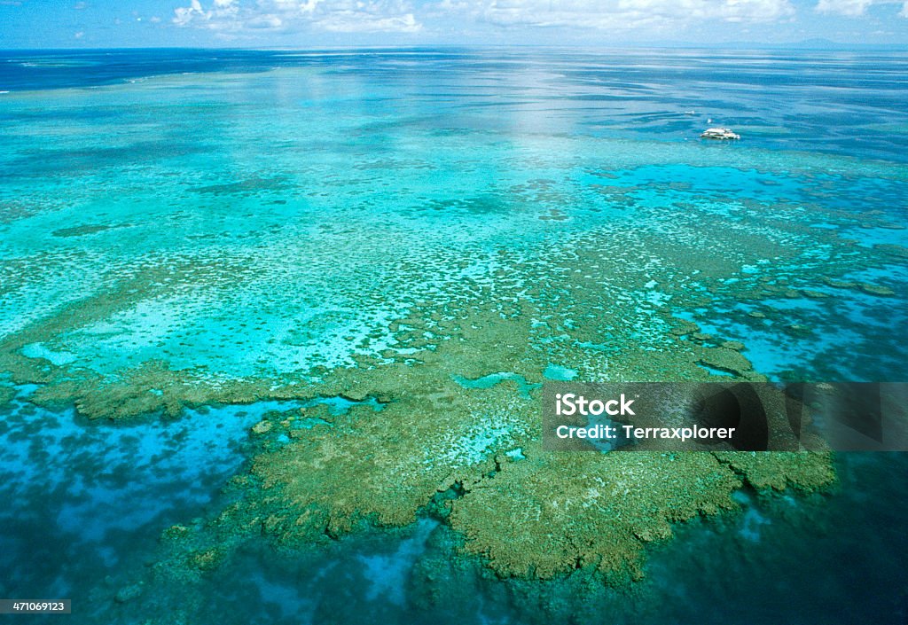 Aerial View Of Great Barrier Reef Located off the northeastern coast of Australia, the Great Barrier Reef is the largest coral reef system in the world. Great Barrier Reef Stock Photo