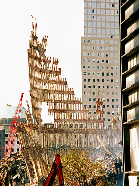The aftermath of destruction on the World Trade Center NY Steel Skeleton of World Trade Center Tower South (one) in Ground Zero days after September 11, 2001 terrorist attack which collapsed the 110 story twin towers in New York, USA. lower manhattan stock pictures, royalty-free photos & images