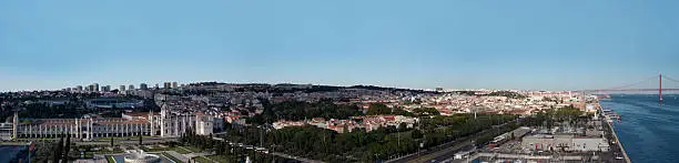 The Monastery of Jeronimos - district of Belem - in Lisbon (Portugal). In the rear we can see the 25th April bridge which crosses the Tage river. This picture was shot on the top of the famous monument of "Discovery" just built at the shore of the Tage River.