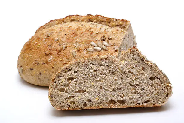 whole grain bread,loaf and slice, on white background