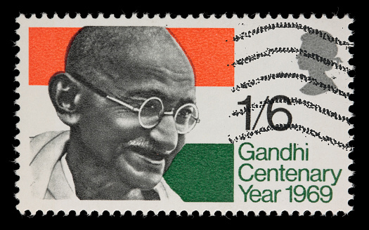 1969 Great Britain stamp with an image of Mahatma Gandhi in front of an Indian flag. Canon 40D with 100mm macro; no sharpening.