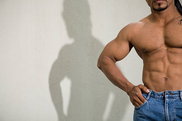 athletic male torso and shadow stock photo