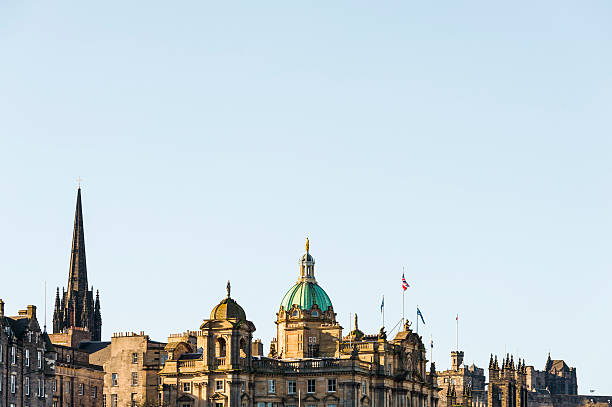 Neo classical 19th century domes and sculptures on the Bank of Scotland (now HBOS) building, on the Mound in Edinburgh Old Town. Early morning clear sunlight.