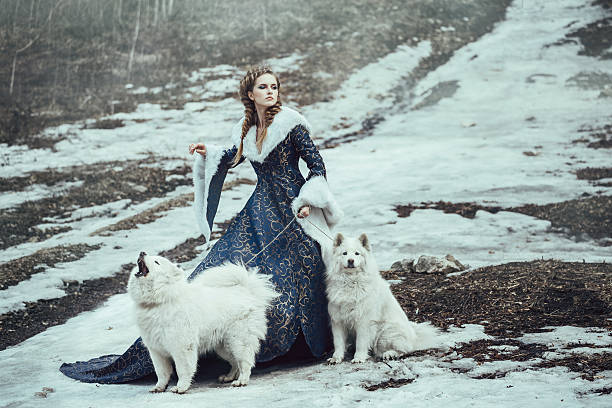 The woman in blue coat walk with a dog