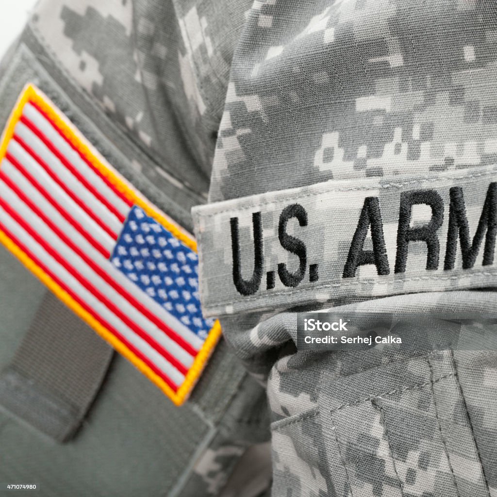 U.S. Army and flag patch on solder's uniform U.S. Army and flag patch on solder uniform 2015 Stock Photo