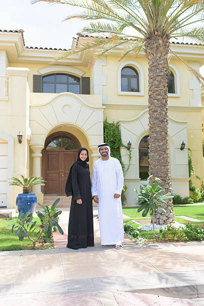 istock Young outside their luxury Dubai Villa 471075236