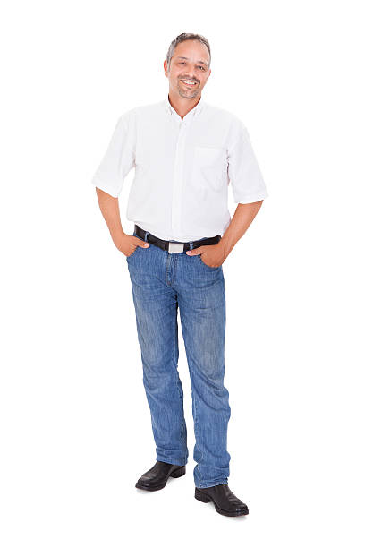 istock Smiling Mature Man Standing With Hands In Pockets 471075416