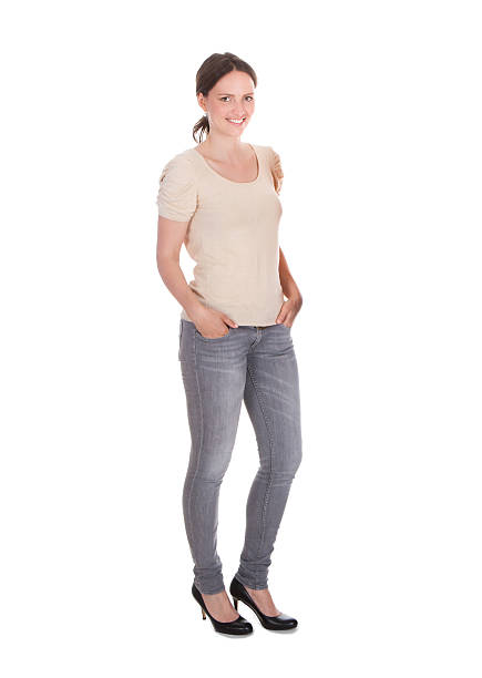 istock Attractive Woman Standing Against White Background 471075724