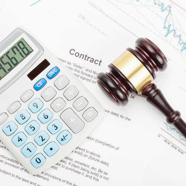 istock Gavel and calculator over contract - close up shot 471075812