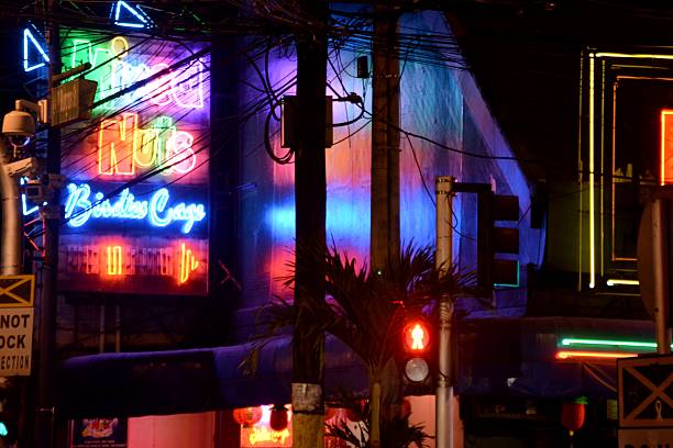 Burgos street neon signs in Makati district, Manila Philippines Manila, Philippines - January 25, 2014: Night view of the popular Burgos street, surrounded by colourful neon signs. The street is the center of Makati nightlife in this Red Light district of Manila. Makati district is also known for being a major cultural and adult entertainment hub in Metro Manila.  strip club stock pictures, royalty-free photos & images