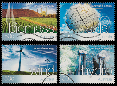 2004 Australia renewable resources stamps featuring biomass, hydro, solar, and wind power. Composite image of 4 photos. Canon 40D with 100mm macro; no sharpening.