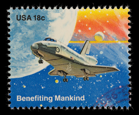 1981 US postage stamp depicting a space shuttle with its landing gear deployed. Canon 40D with 100mm macro; no sharpening.