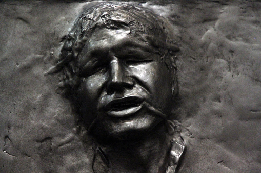 Vancouver, Canada - April 4, 2015: A model of Han Solo, frozen in carbonite. Han Solo was frozen in the preserving metal during Star Wars: The Empire Strikes Back,